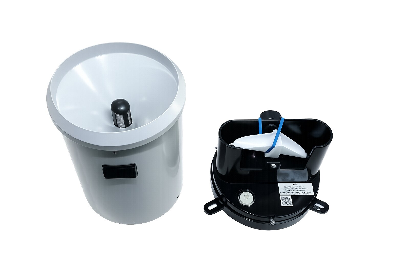 Internal view of the tipping-bucket gauge: funnel, screen and the tipping mechanism.